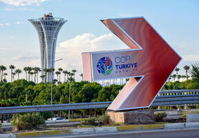 Sign reading “COP31 Antalya” near the entrance to the Antalya Expo Center in Turkey.