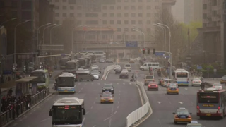 A road in Beijing in March 2018, engulfed in a cloud of smog. Urban pollution has prompted China to embark on a proactive energy transition.