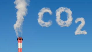 Photo montage symbolizing carbon dioxide emissions into the atmosphere